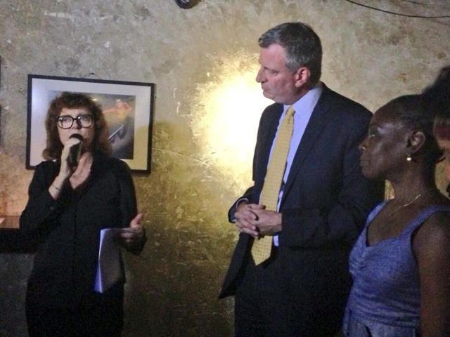 Sarandon speaks, with de Blasio and McCray on the right